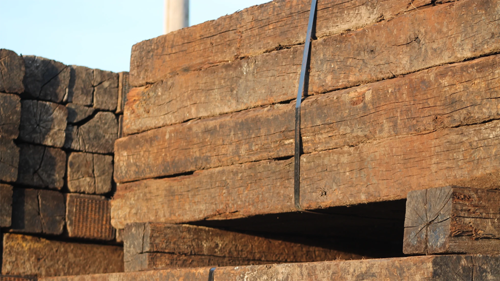 A close up image or railroad ties at Straight Line Fence