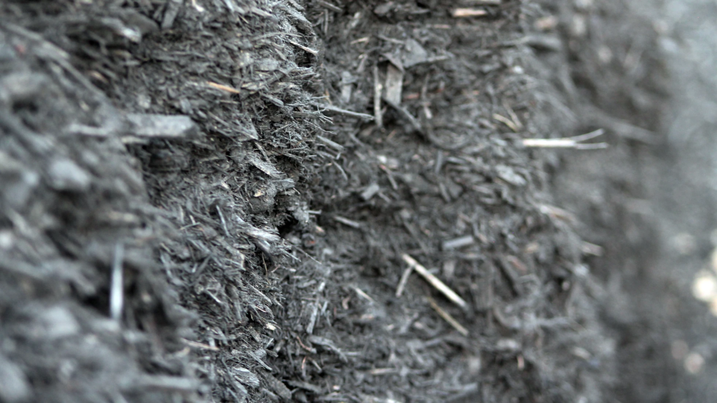 A photo of black mulch from Straight Line Fence.