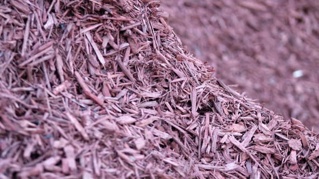 A photo of red mulch from Straight Line Fence.