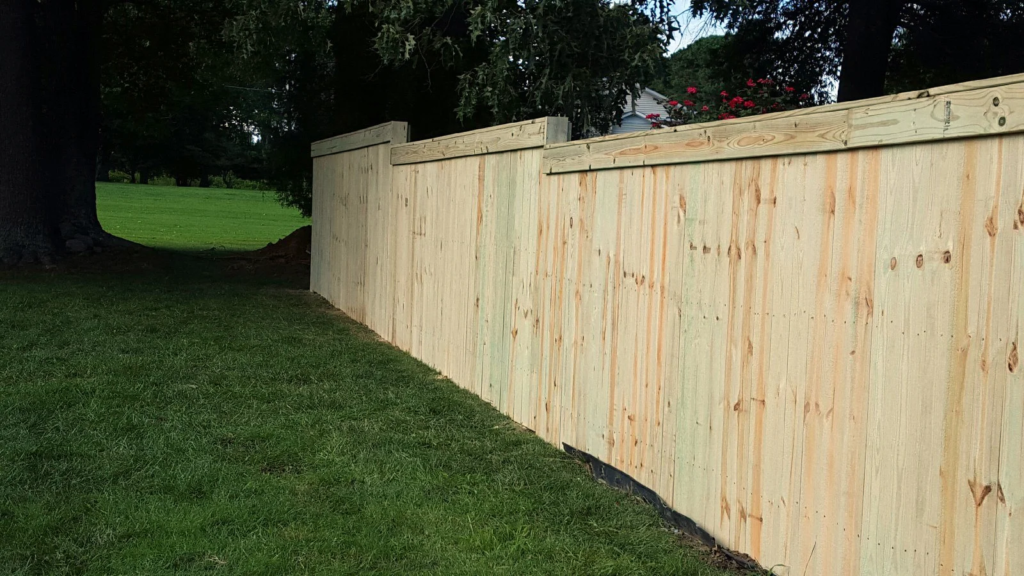 Capped Down Stepping Wood Fence