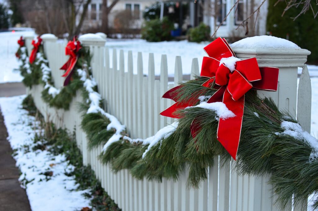 vinyl fence with christmas garland